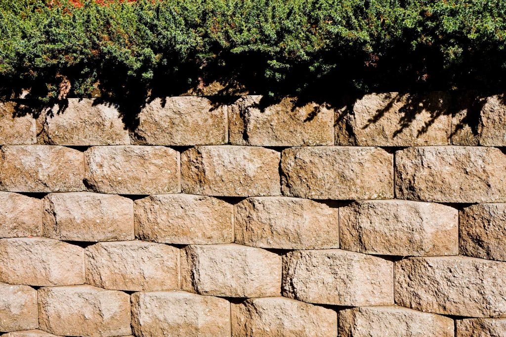 Diggers Construction using concrete blocks for retaining walls